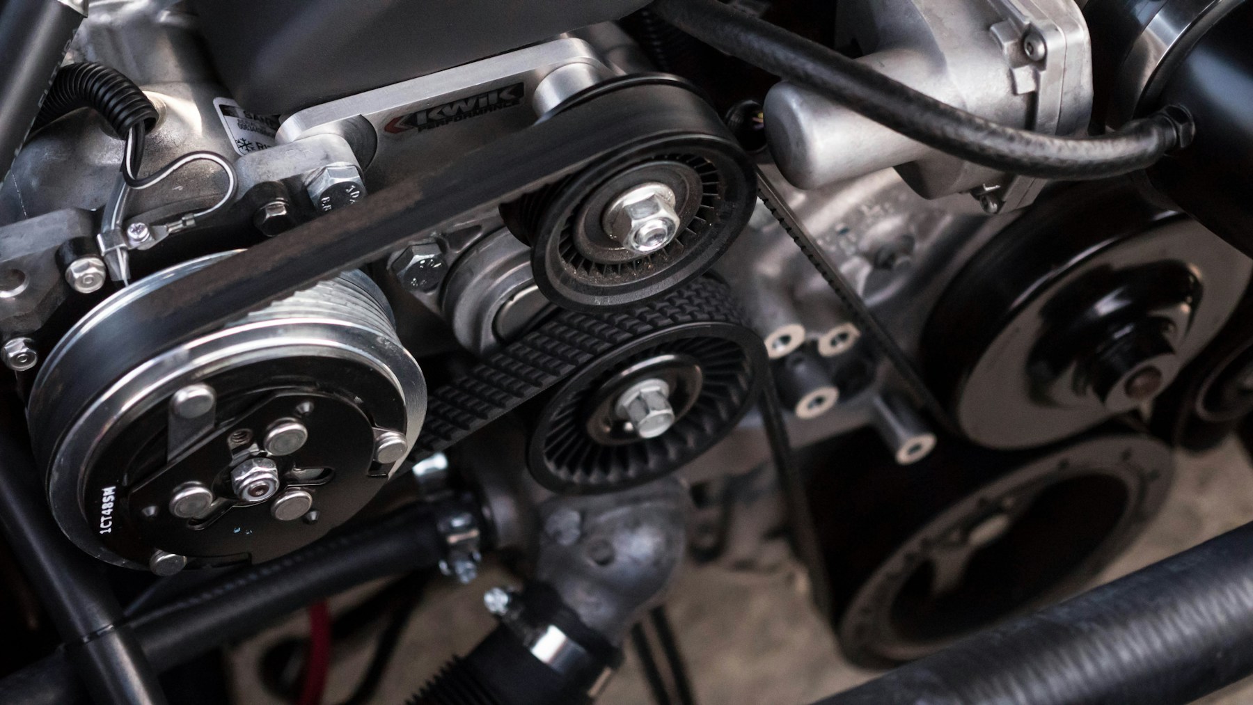 Close-up of automotive engine belts and pulleys